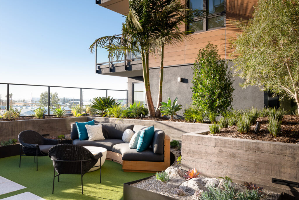 Outdoor area with shade and sitting availability.